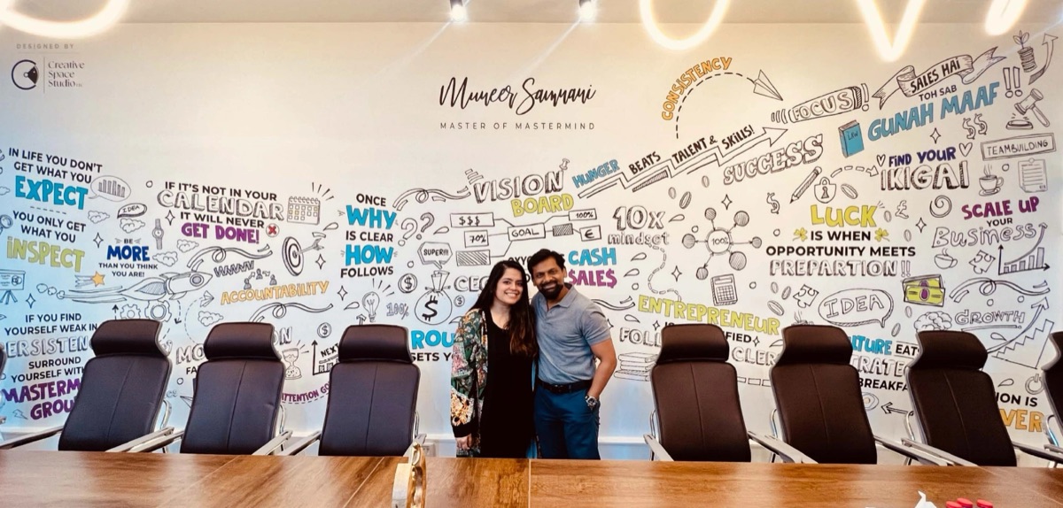 Hand-drawn mastermind wall mural in a boardroom